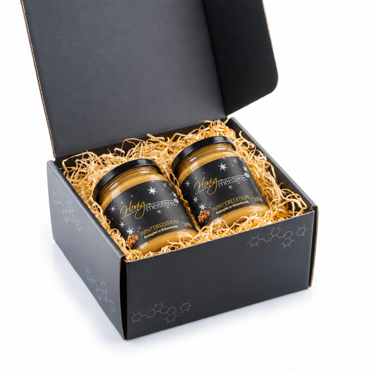 Bratapfel Geschenkset – offene Box mit 2 × 330 g Offene schwarze Geschenkbox mit zwei Gläsern Bratapfel-Edition à 330 g und Holzwolle